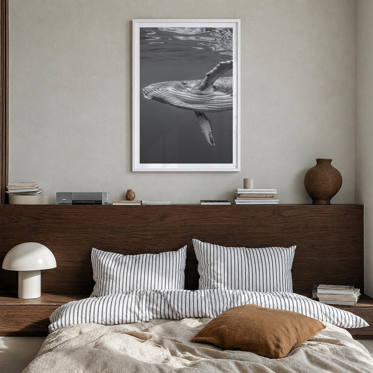 Whale no. 1 black & white photo poster – vertical wall art in white wood frame with white border, hanging on wall