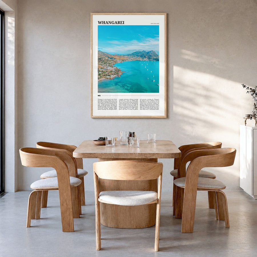 Whangārei Travel Poster in a natural wood frame, hanging in a dining room