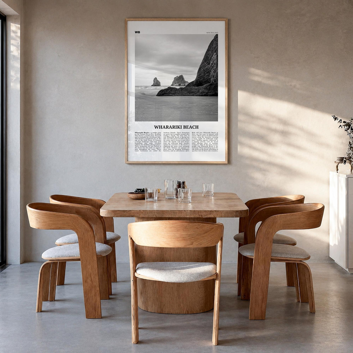 Wharariki Beach black & white newspaper poster of New Zealand – vertical wall art in natural wood frame, hanging on wall