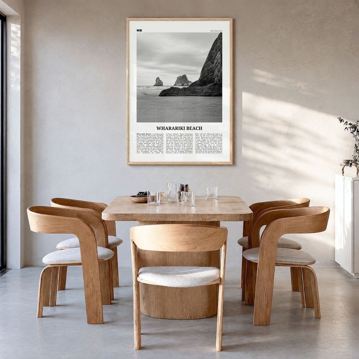 Wharariki Beach Newspaper Poster in a natural wood frame, hanging in a dining room
