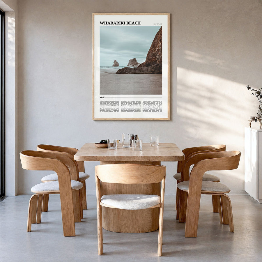 Wharariki Beach Travel Poster in a natural wood frame, hanging in a dining room