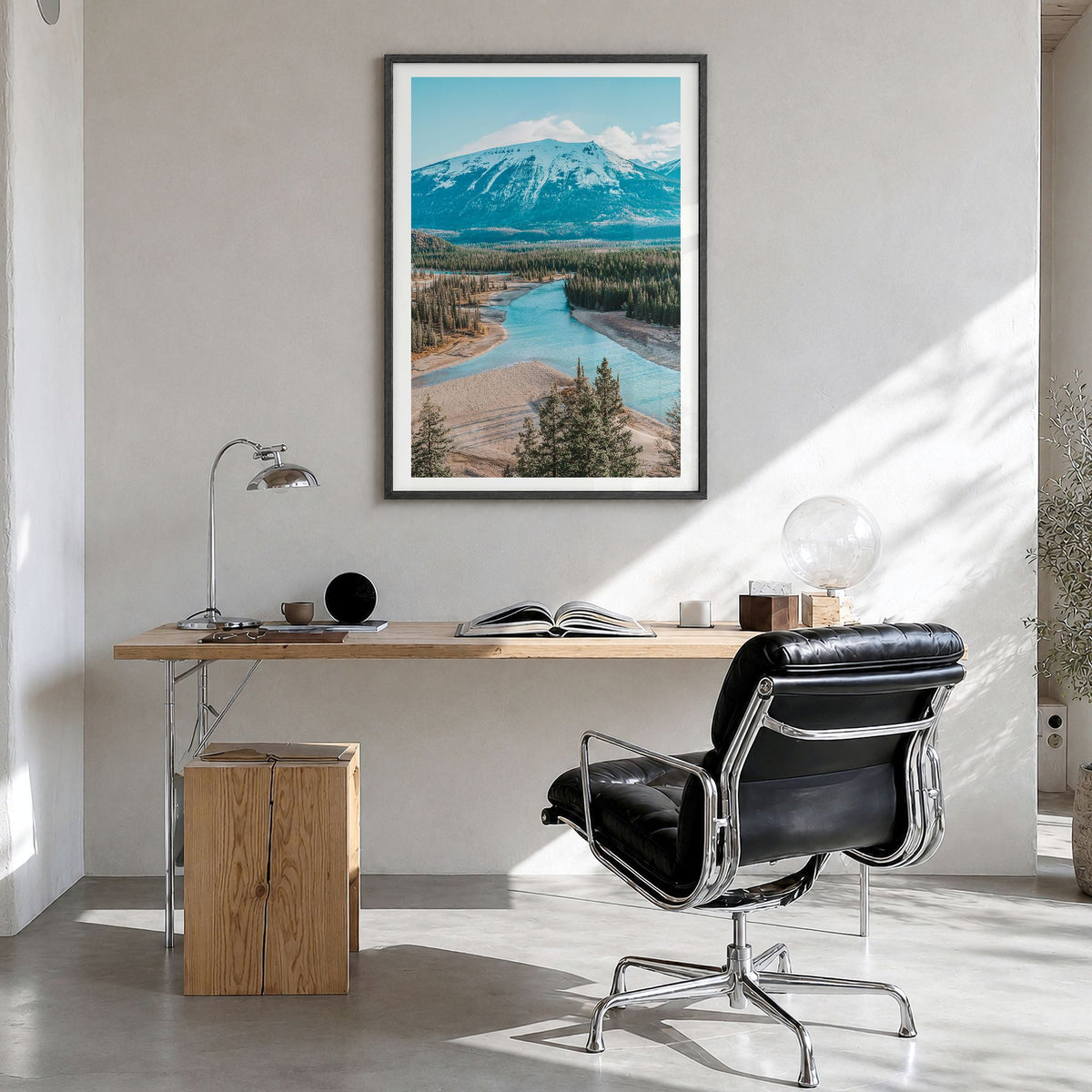 Whistler Photo Poster in a black wood frame, hanging in a bright home office, white border