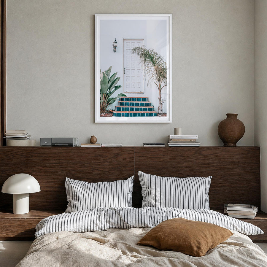 White Door colorful photo poster – vertical wall art in white wood frame with white border, hanging on wall
