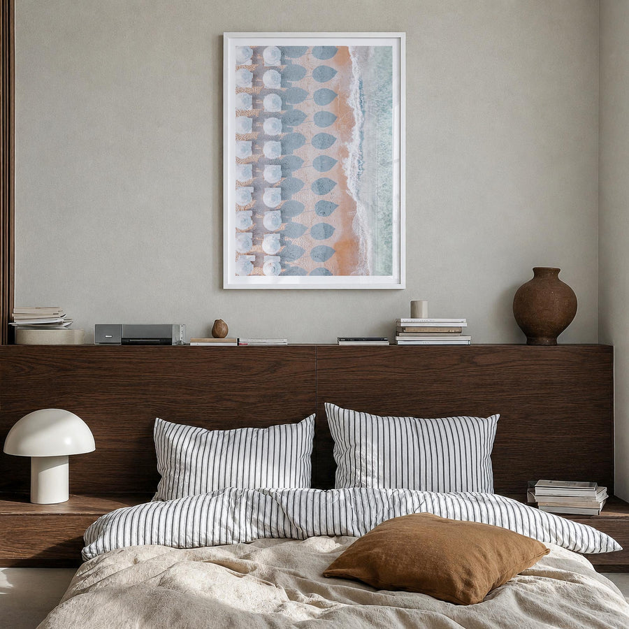 White Umbrellas colorful photo poster – vertical wall art in white wood frame with white border, hanging on wall