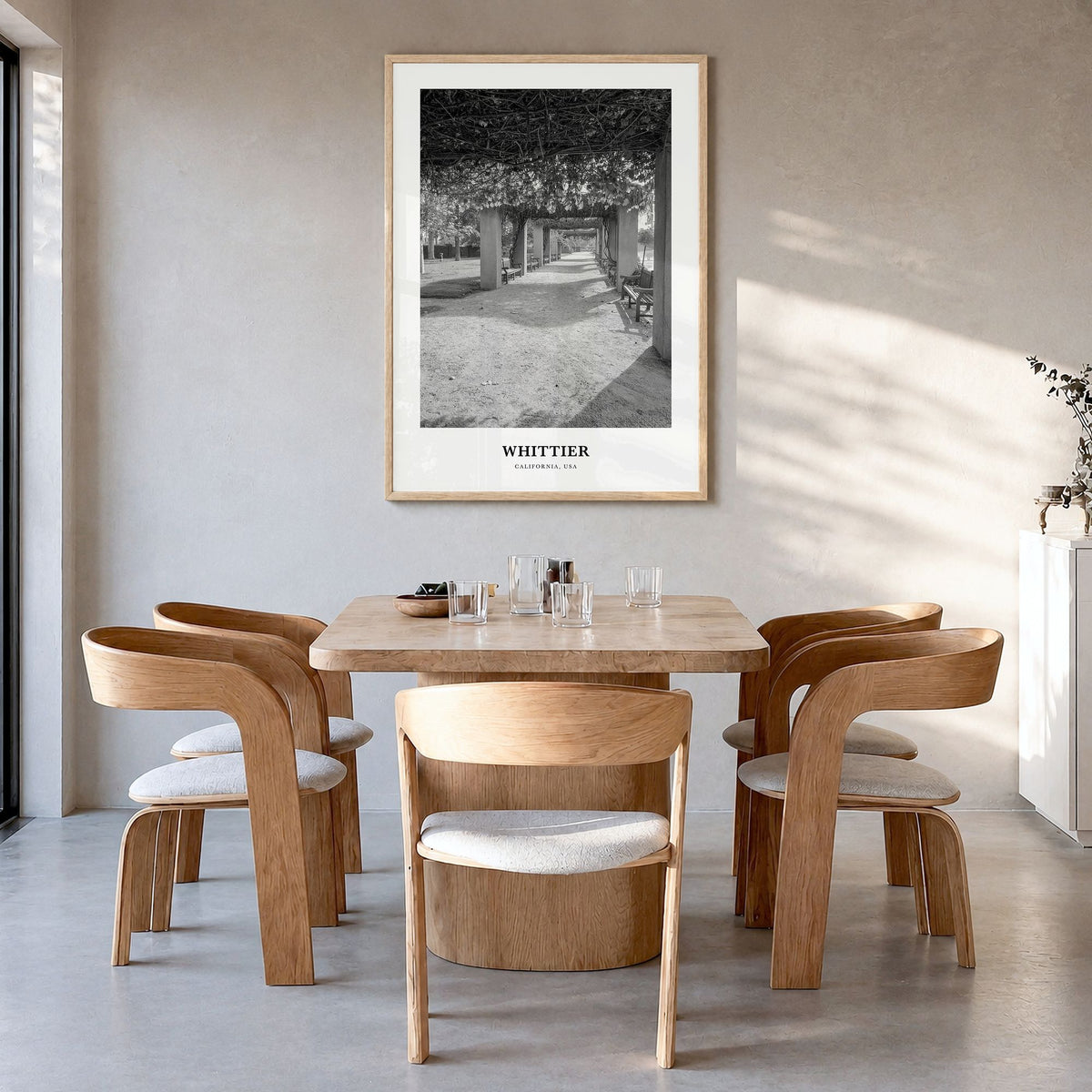 Whittier, California Classic Poster in a natural wood frame, hanging in a dining room