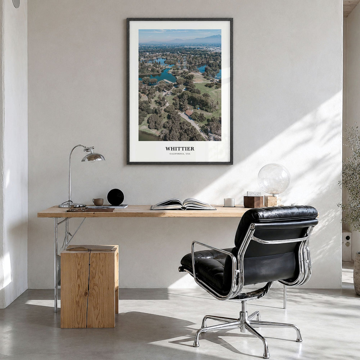 Whittier, California Classic Poster in a black wood frame, hanging in a bright home office