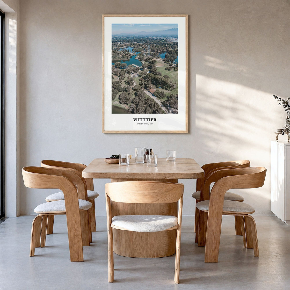 Whittier, California Classic Poster in a natural wood frame, hanging in a dining room