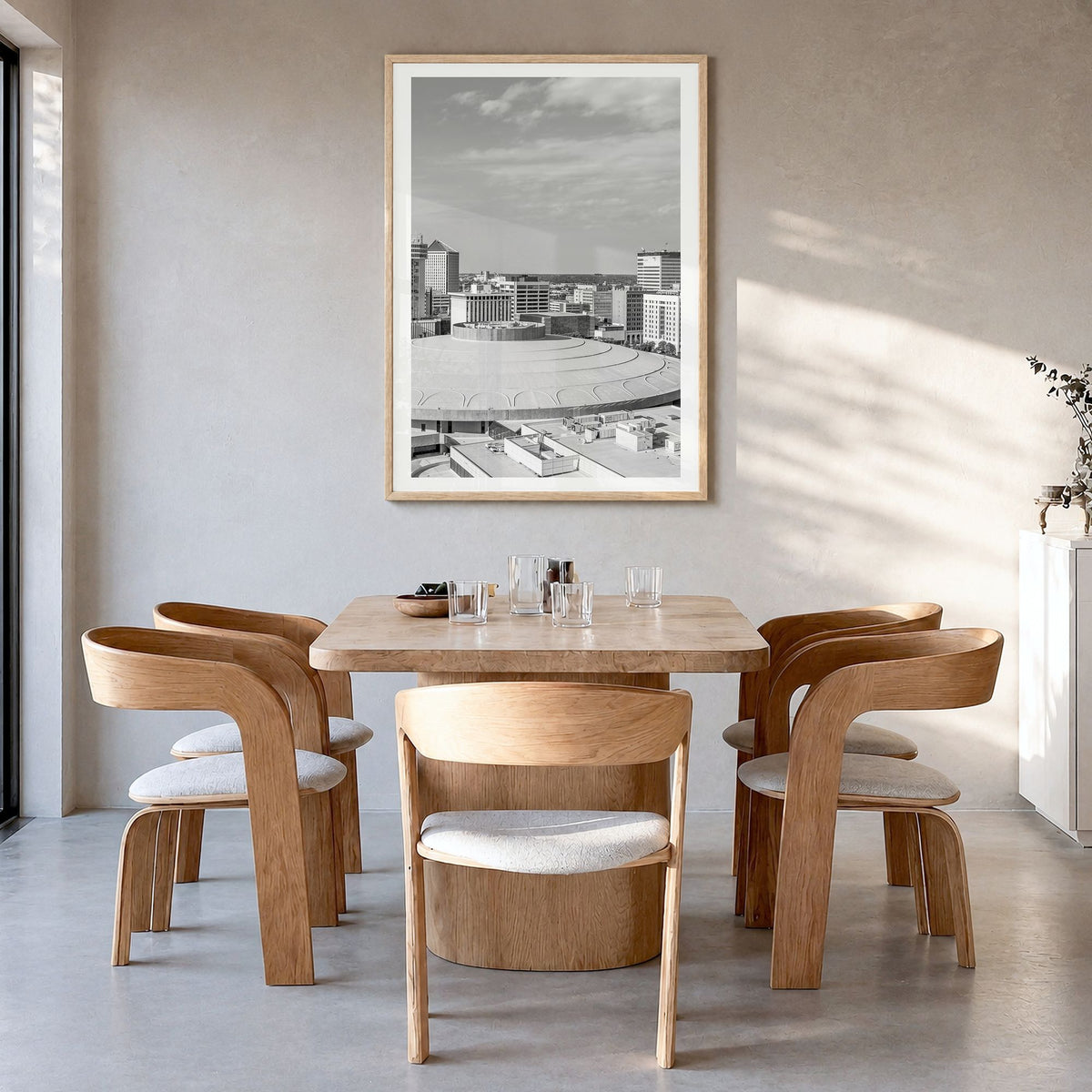 Wichita Photo Poster in a natural wood frame, hanging in a dining room, white border