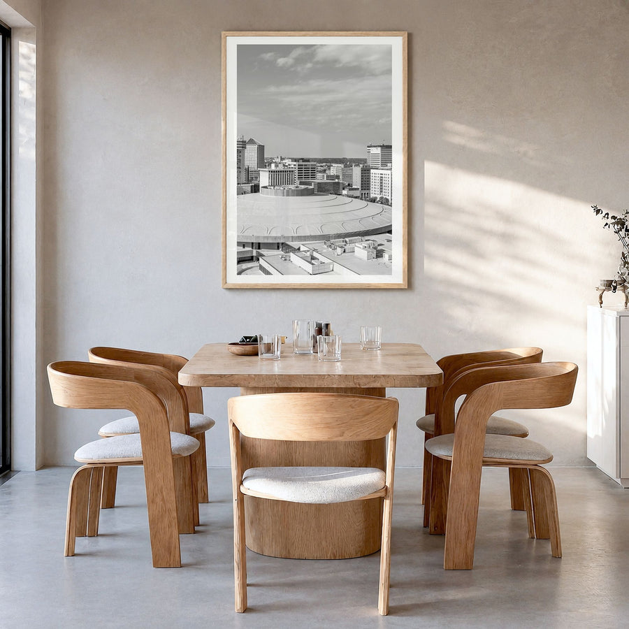 Wichita Photo Poster in a natural wood frame, hanging in a dining room, white border