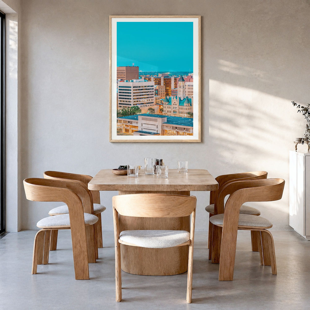 Wichita Photo Poster in a natural wood frame, hanging in a dining room, white border