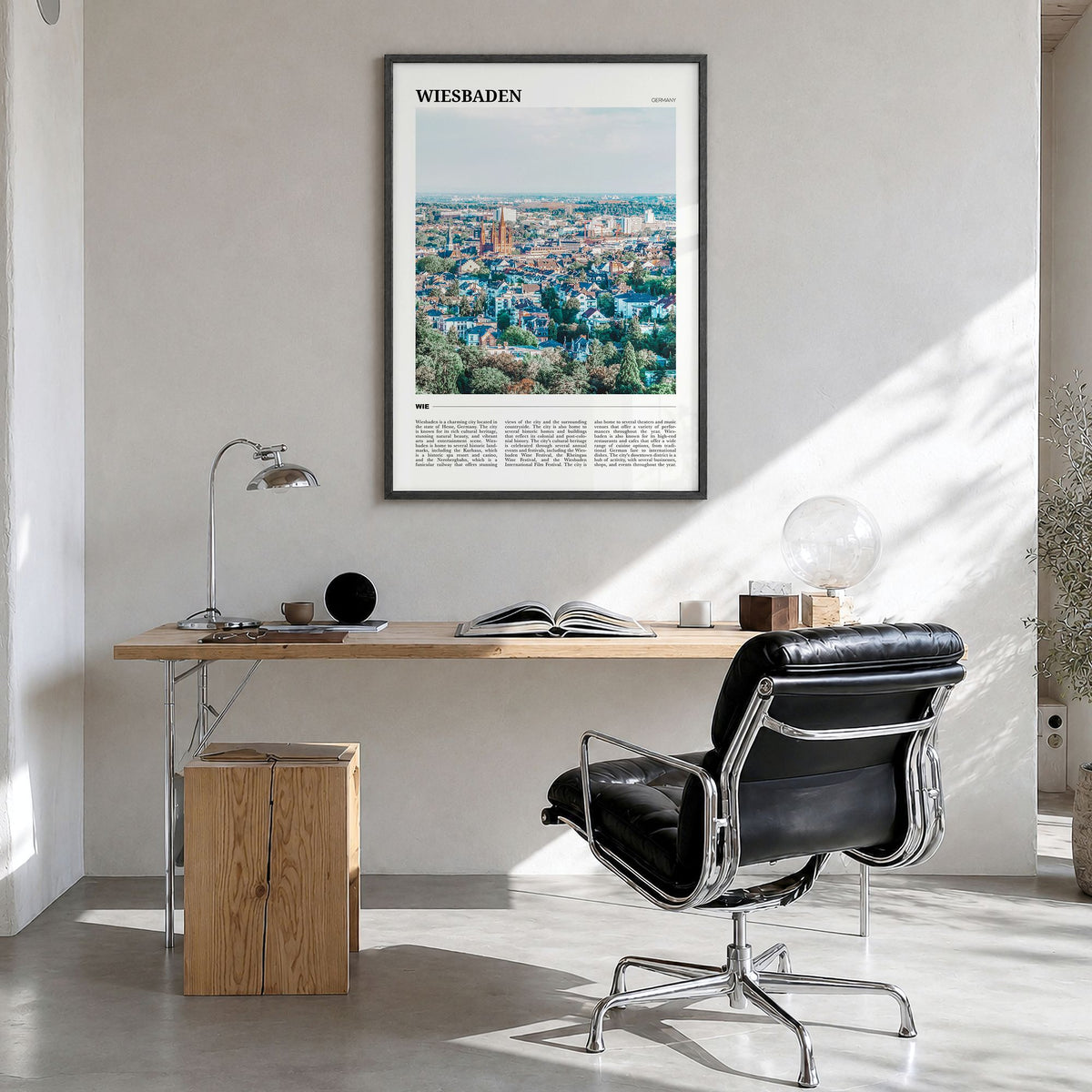 Wiesbaden Travel Poster in a black wood frame, hanging in a bright home office
