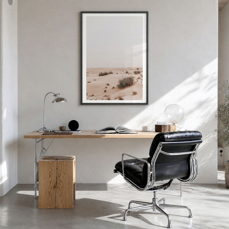 Wild Desert Photo Poster in a black wood frame, hanging in a bright home office, white border