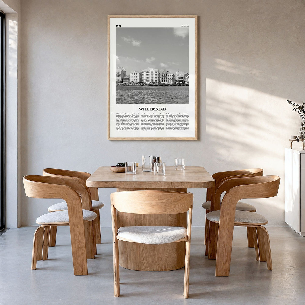 Willemstad Newspaper Poster in a natural wood frame, hanging in a dining room