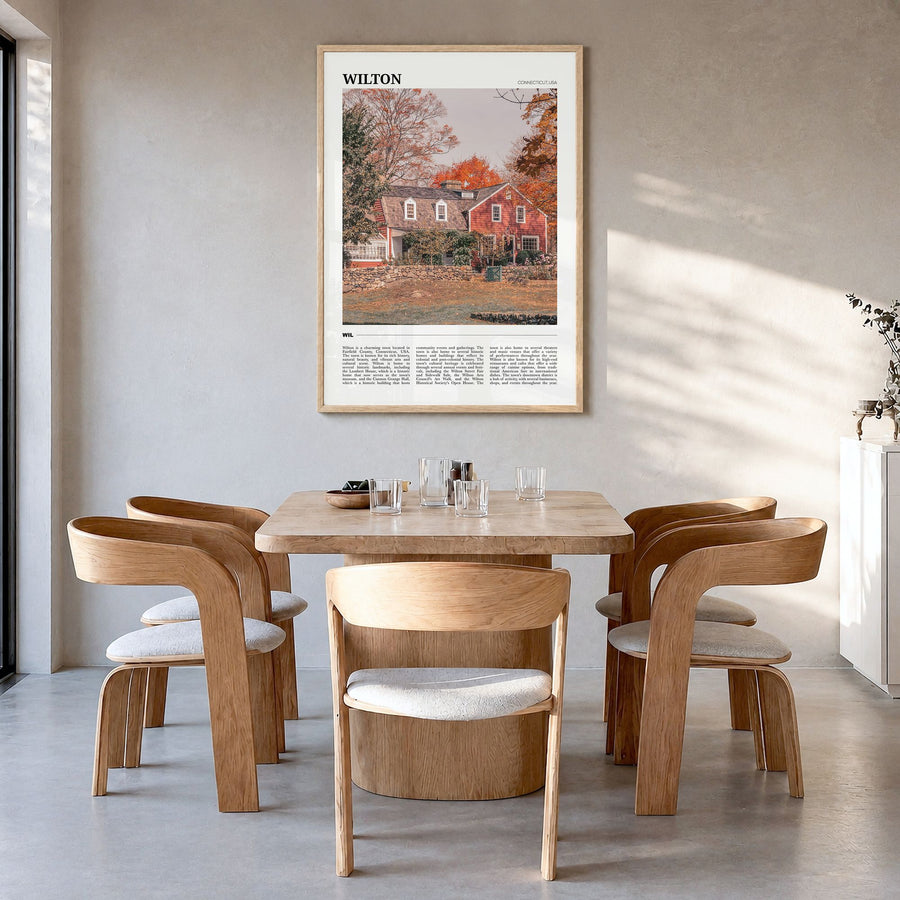 Wilton Travel Poster in a natural wood frame, hanging in a dining room