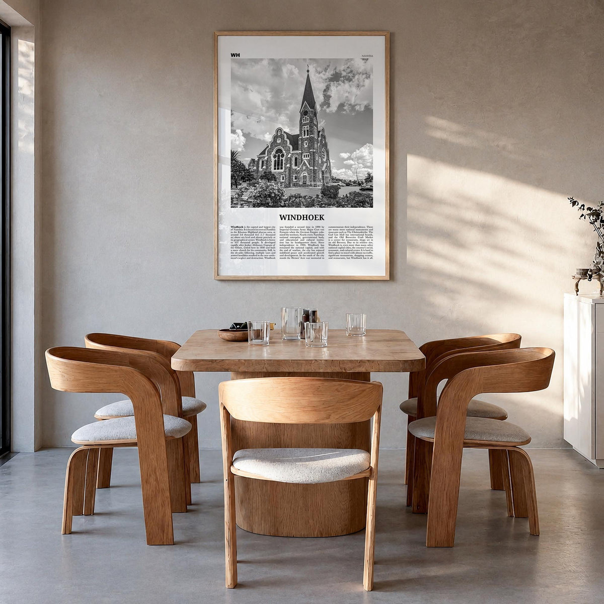 Windhoek black & white newspaper poster of Namibia – vertical wall art in natural wood frame, hanging on wall