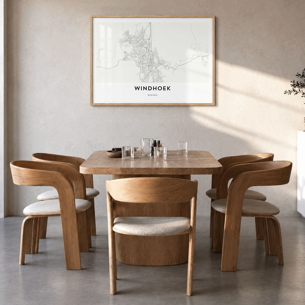Windhoek Map Poster in a natural wood frame, hanging in a dining room
