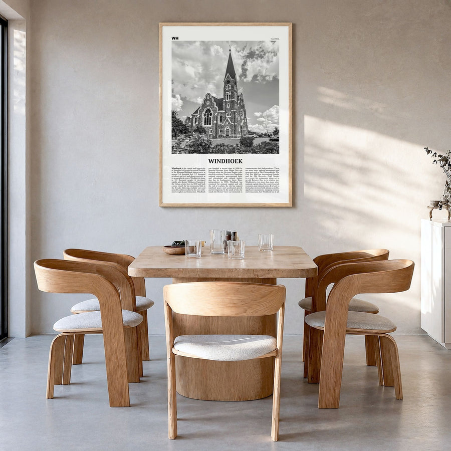 Windhoek Newspaper Poster in a natural wood frame, hanging in a dining room