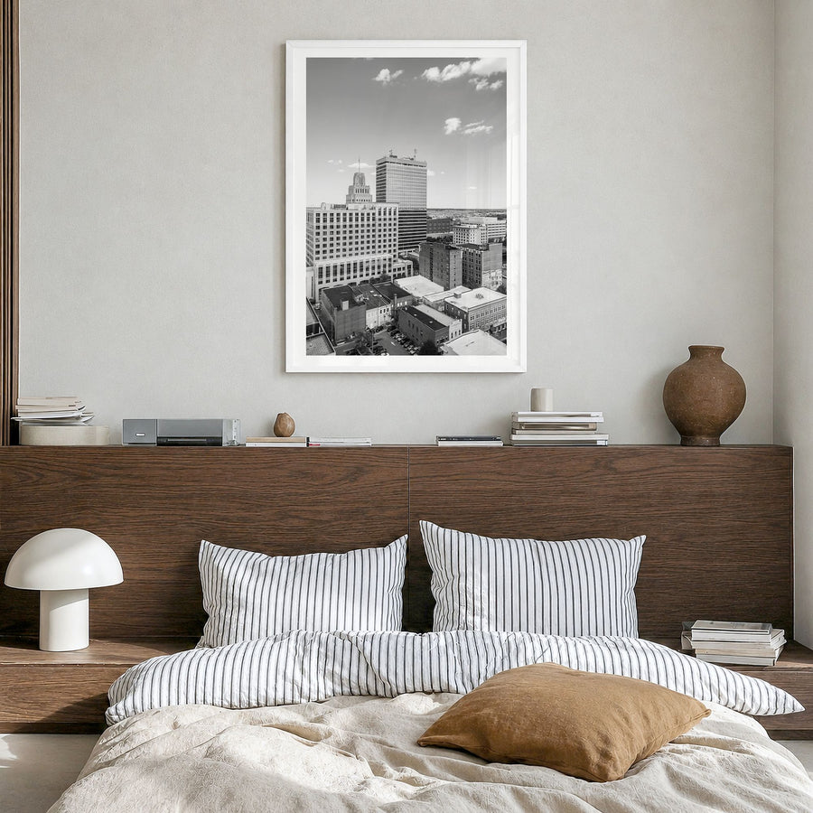 Winston-Salem Photo Poster in a white wood frame, hanging in a bedroom, white border