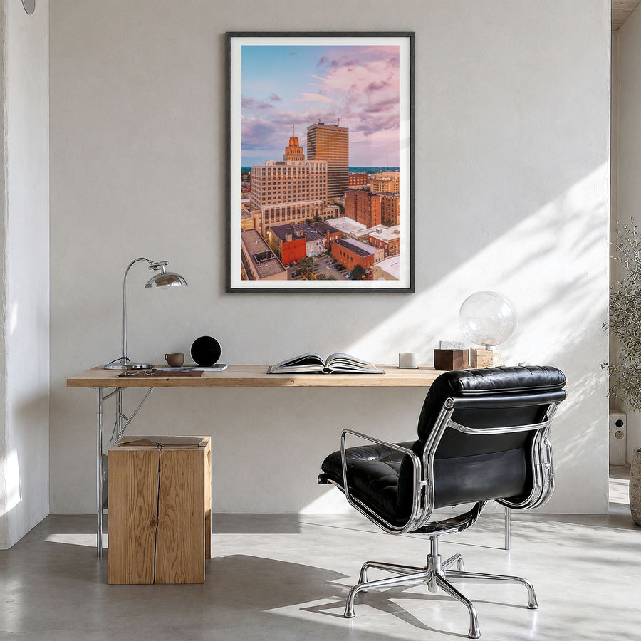 Winston-Salem Photo Poster in a black wood frame, hanging in a bright home office, white border