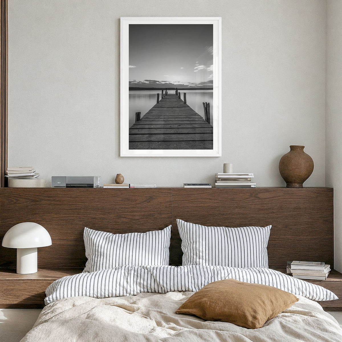 Wooden Dock Photo Poster in a white wood frame, hanging in a bedroom, white border
