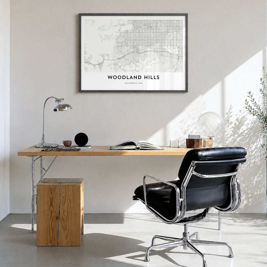 Woodland Hills Map Poster in a black wood frame, hanging in a bright home office
