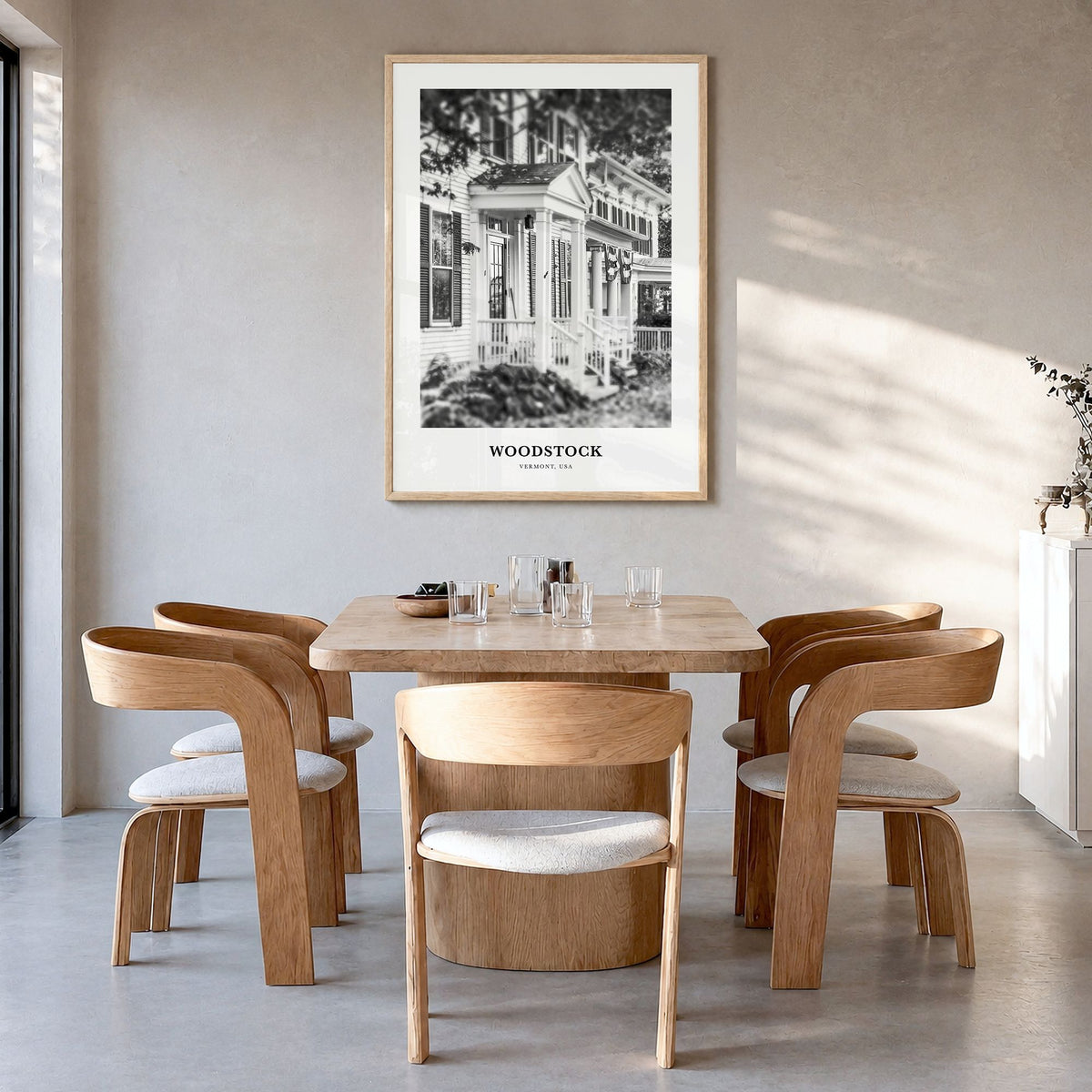 Woodstock, Vermont Classic Poster in a natural wood frame, hanging in a dining room