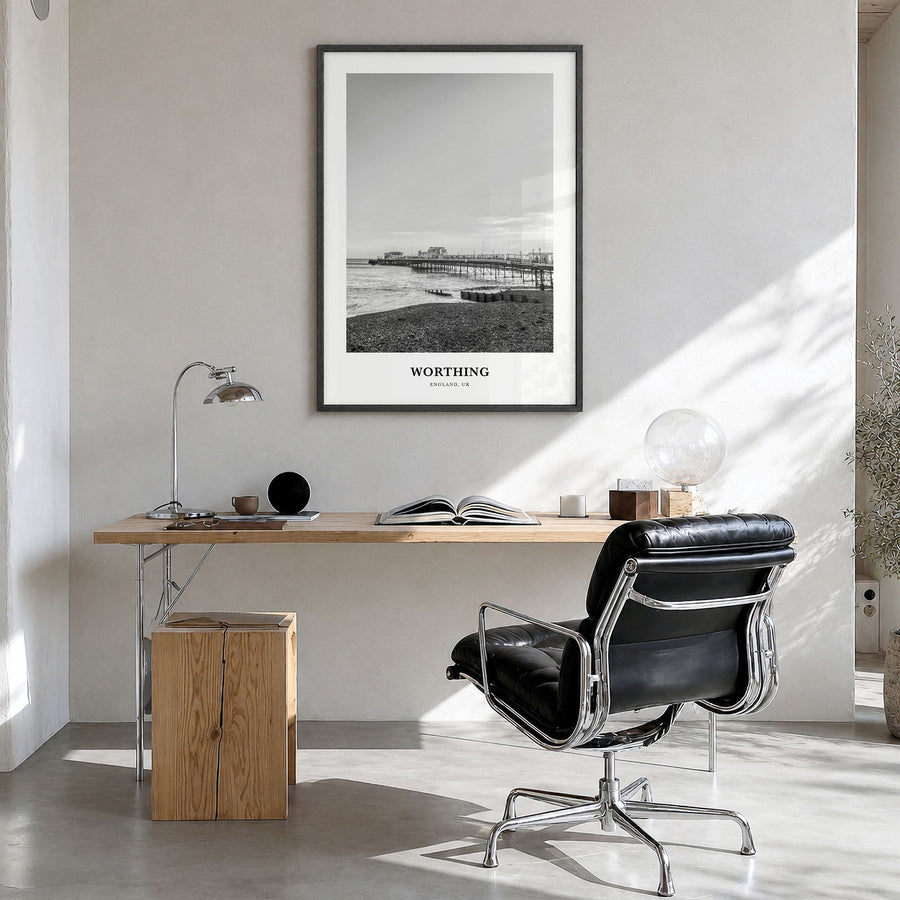 Worthing Classic Poster in a black wood frame, hanging in a bright home office