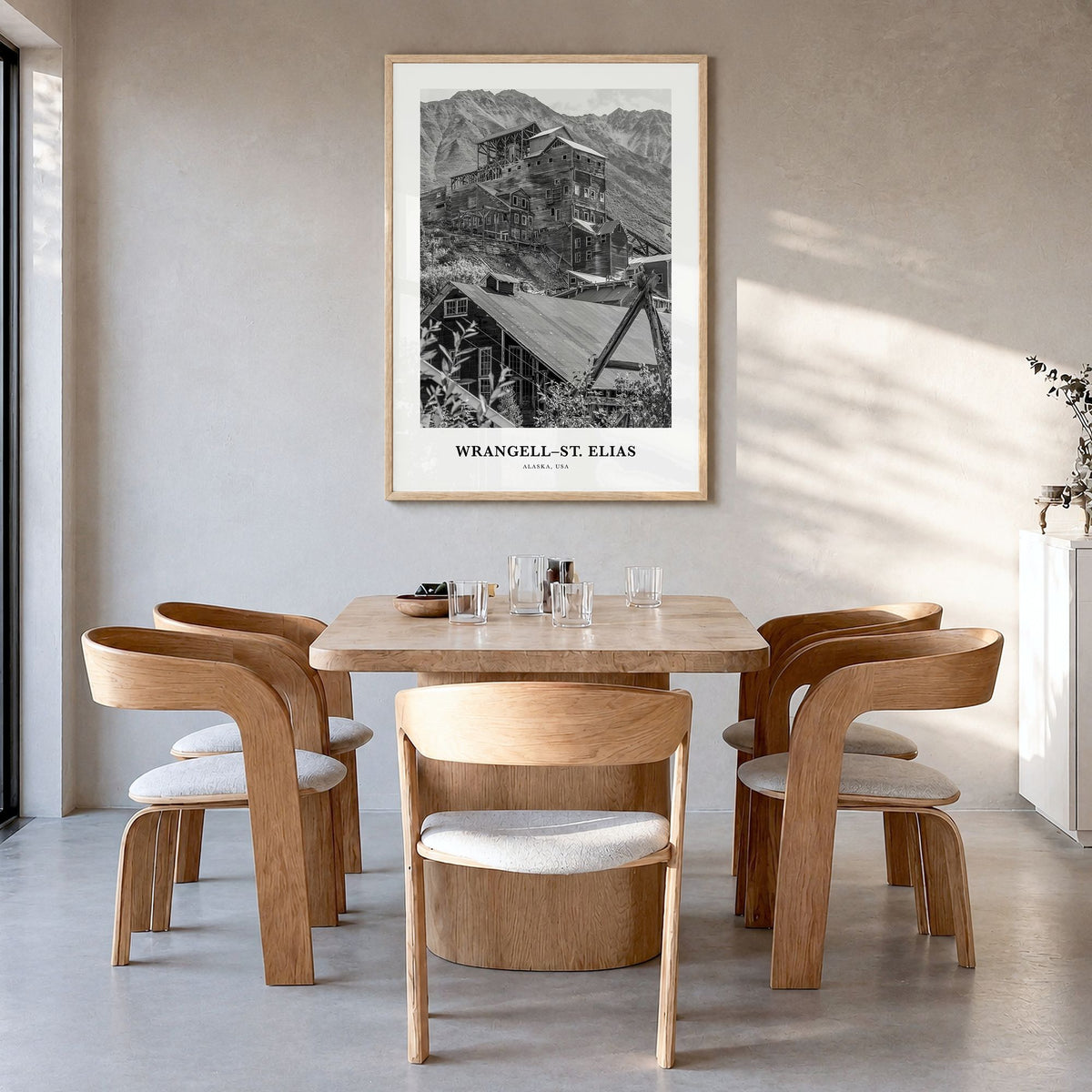 Wrangell-St. Elias Classic Poster in a natural wood frame, hanging in a dining room