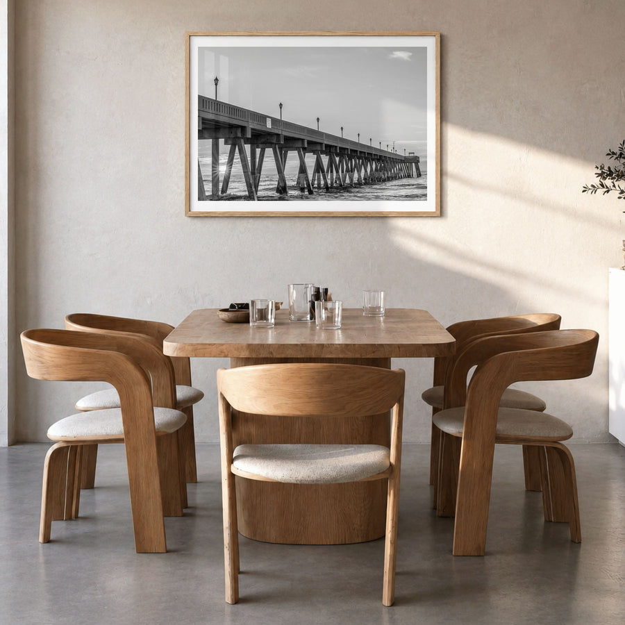 Wrightsville Beach Photo Poster in a natural wood frame, hanging in a dining room, white border
