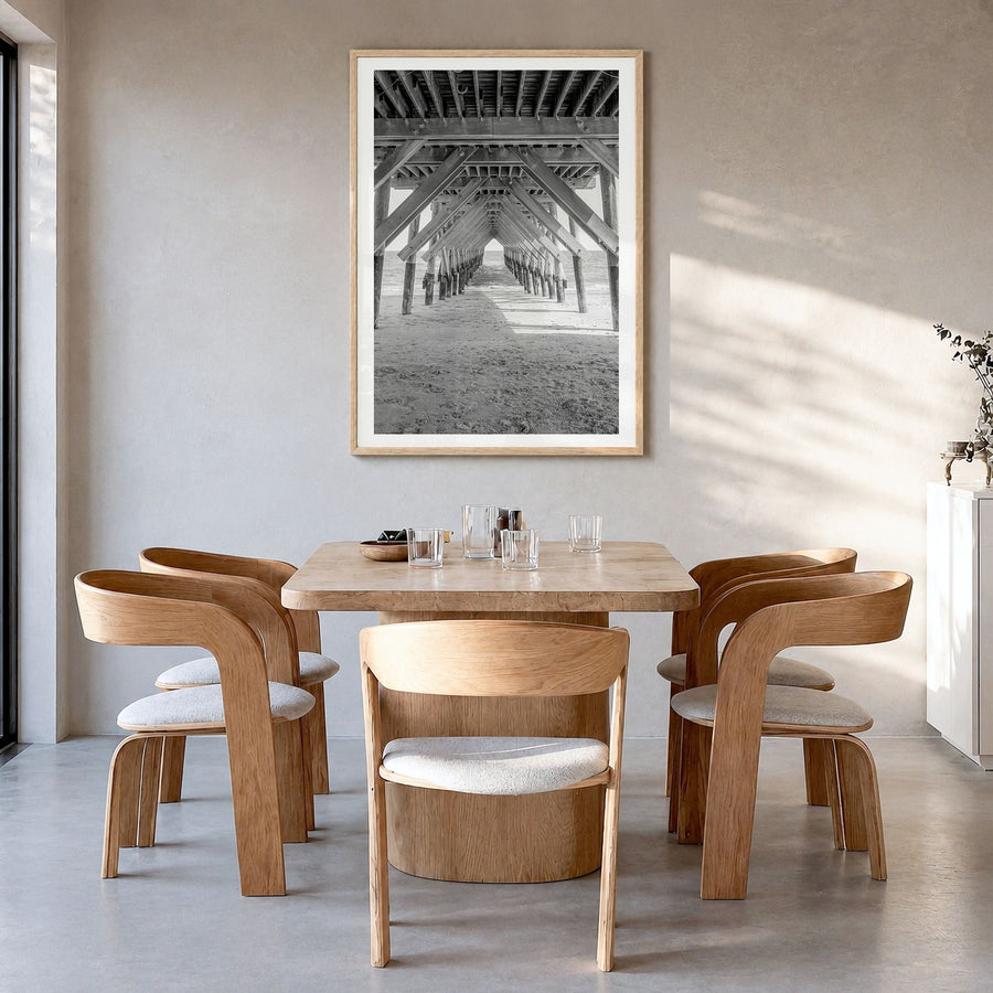 Wrightsville Beach Photo Poster in a natural wood frame, hanging in a dining room, white border