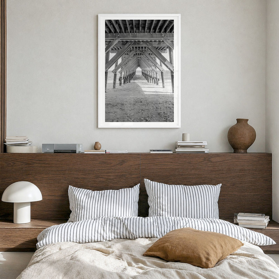 Wrightsville Beach Photo Poster in a white wood frame, hanging in a bedroom, white border
