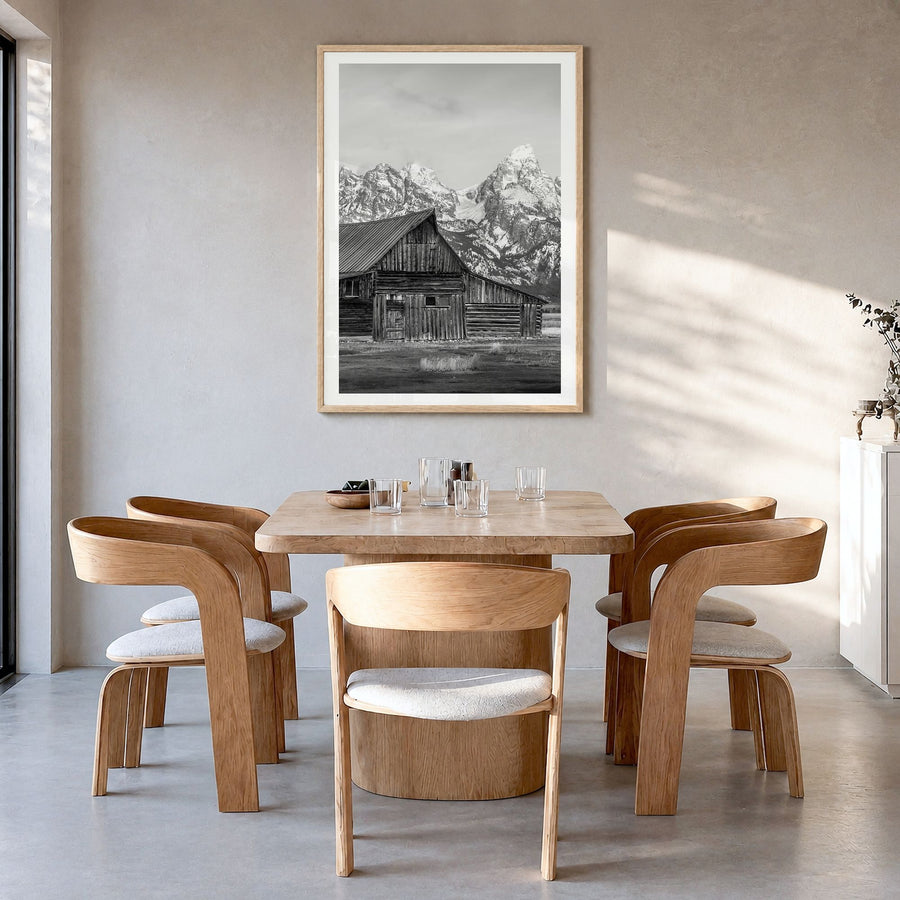 Wyoming Photo Poster in a natural wood frame, hanging in a dining room, white border