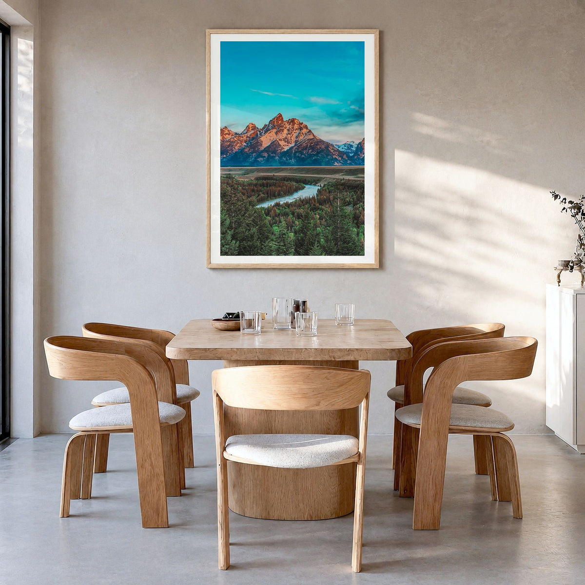 Wyoming Photo Poster in a natural wood frame, hanging in a dining room, white border