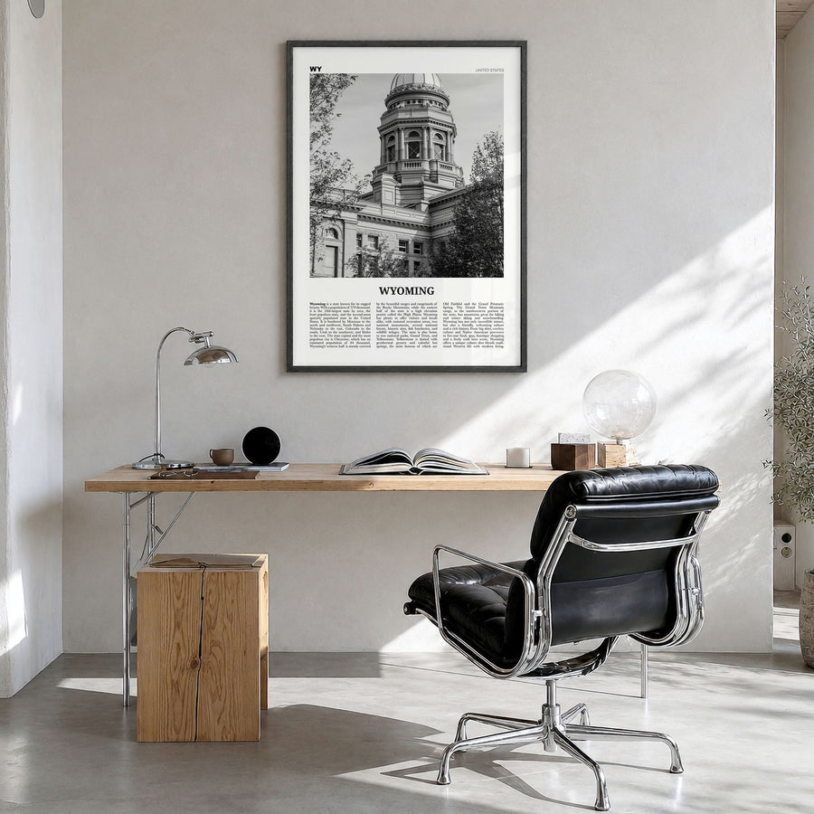 Wyoming Newspaper No 3 Poster in a black wood frame, hanging in a bright home office