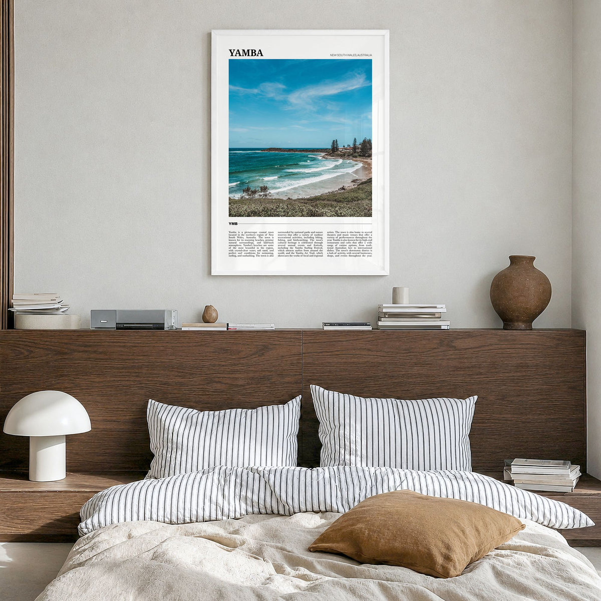 Yamba Travel Poster in a white wood frame, hanging in a bedroom