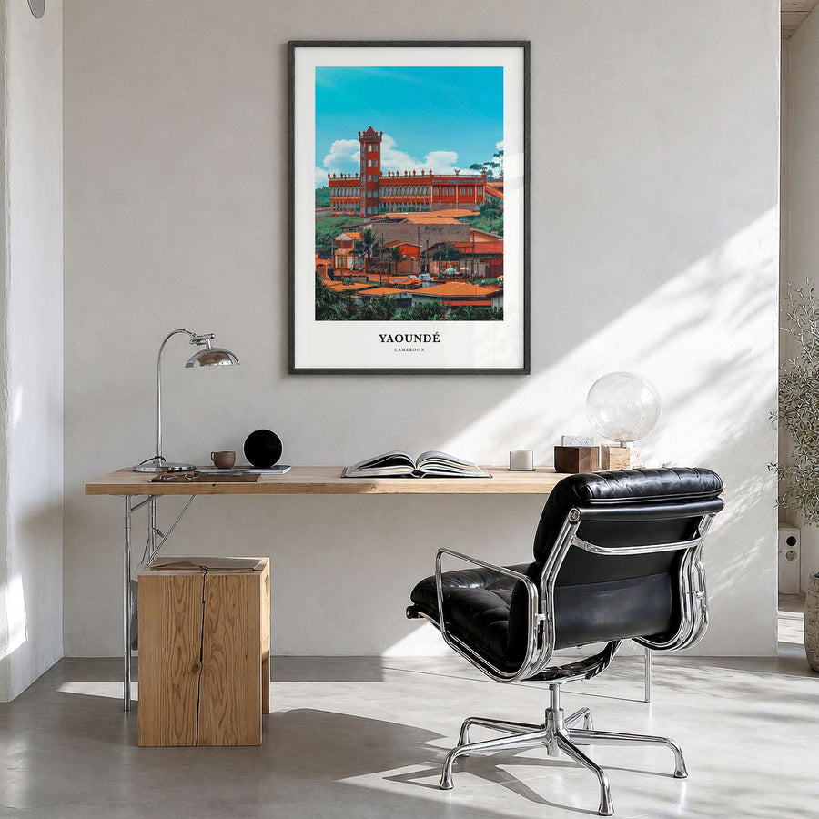 Yaoundé Classic Poster in a black wood frame, hanging in a bright home office