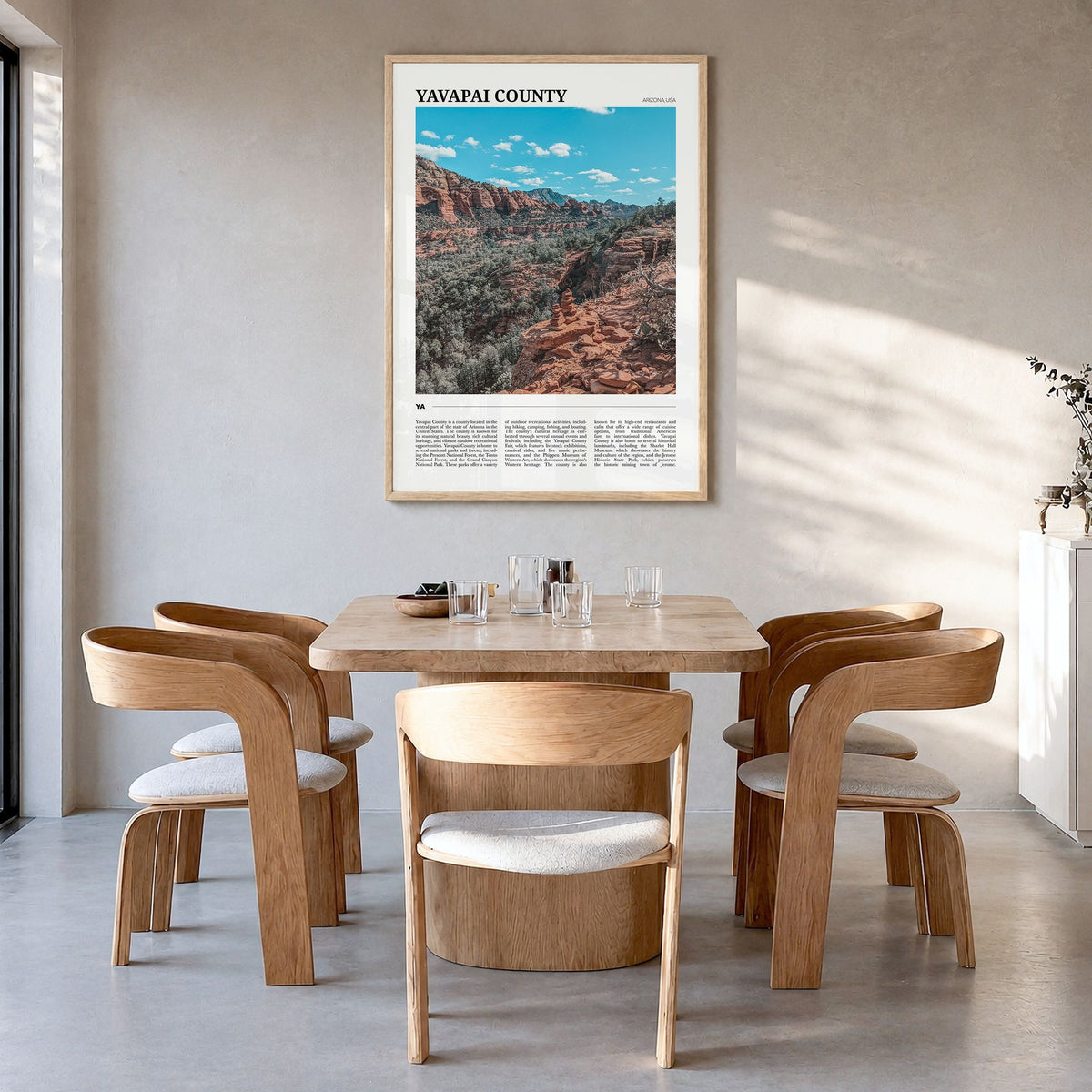 Yavapai County Travel Poster in a natural wood frame, hanging in a dining room