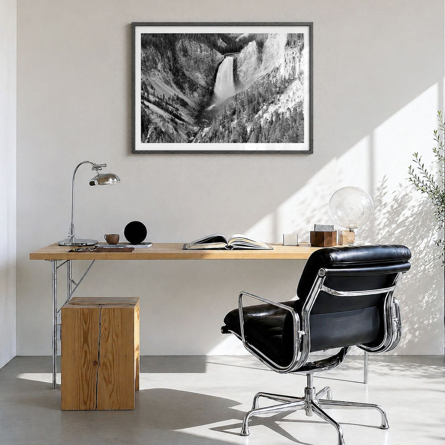 Yellowstone National Park Photo Poster in a black wood frame, hanging in a bright home office, white border