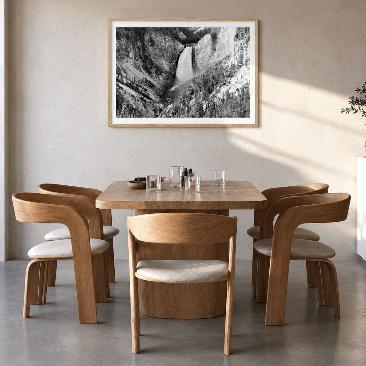 Yellowstone National Park Photo Poster in a natural wood frame, hanging in a dining room, white border