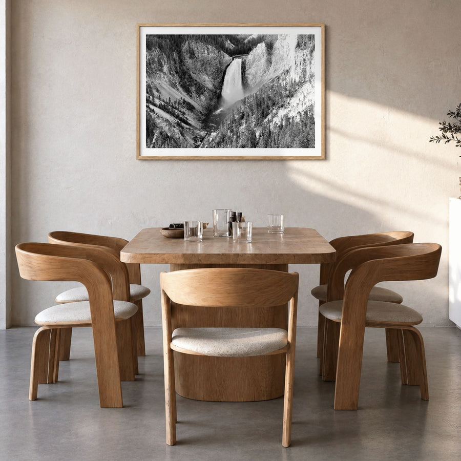 Yellowstone National Park Photo Poster in a natural wood frame, hanging in a dining room, white border