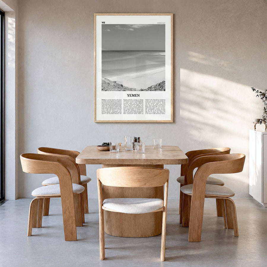 Yemen Newspaper Poster in a natural wood frame, hanging in a dining room