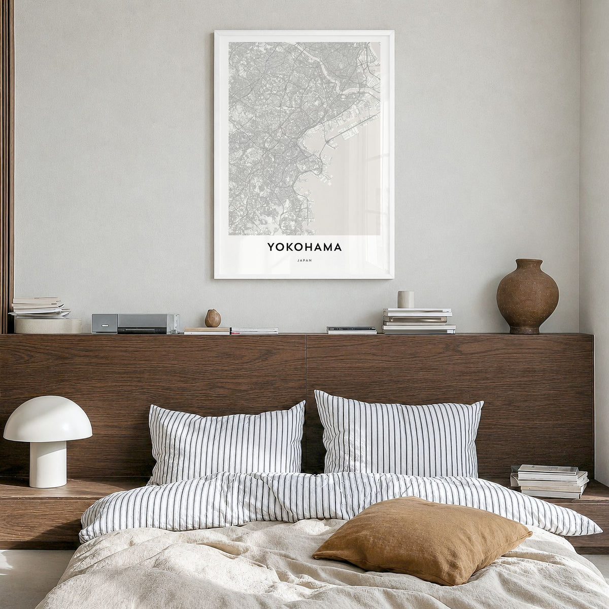 Yokohama Map Poster in a white wood frame, hanging in a bedroom