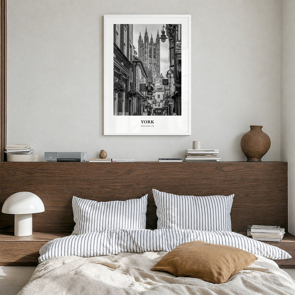 York, England Classic Poster in a white wood frame, hanging in a bedroom