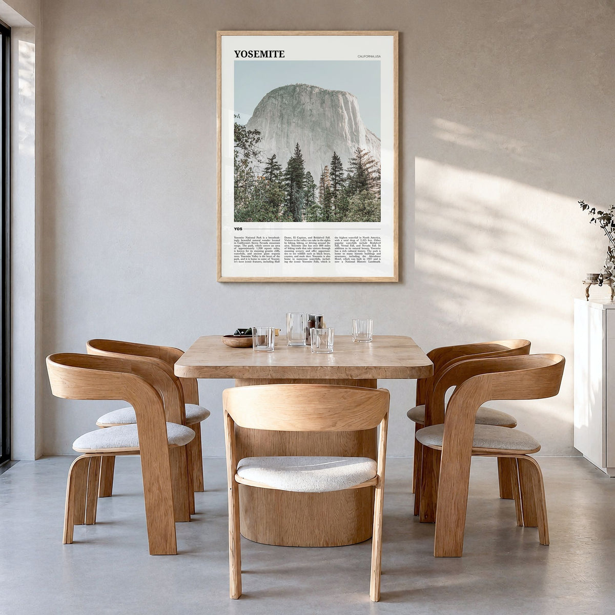 Yosemite National Park Travel Poster in a natural wood frame, hanging in a dining room
