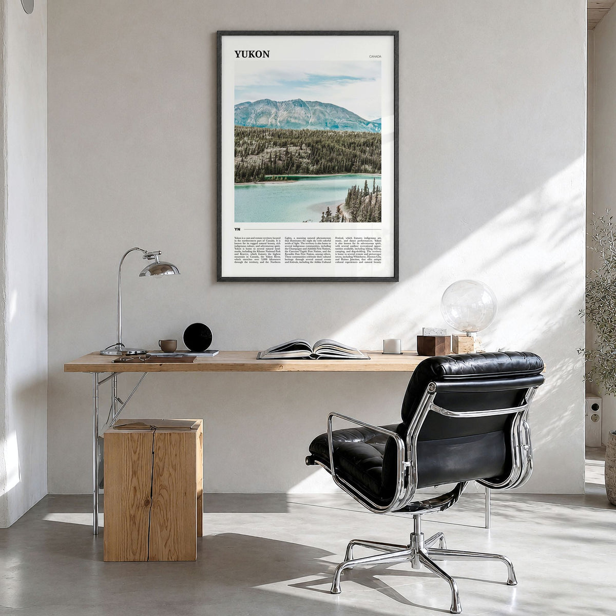 Yukon Travel Poster in a black wood frame, hanging in a bright home office