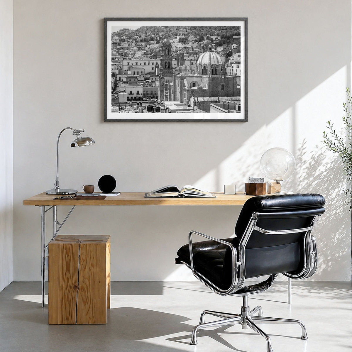 Zacatecas Photo Poster in a black wood frame, hanging in a bright home office, white border