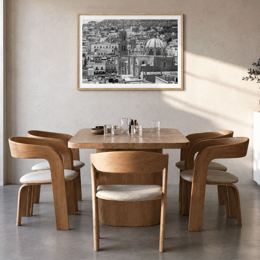 Zacatecas Photo Poster in a natural wood frame, hanging in a dining room, white border