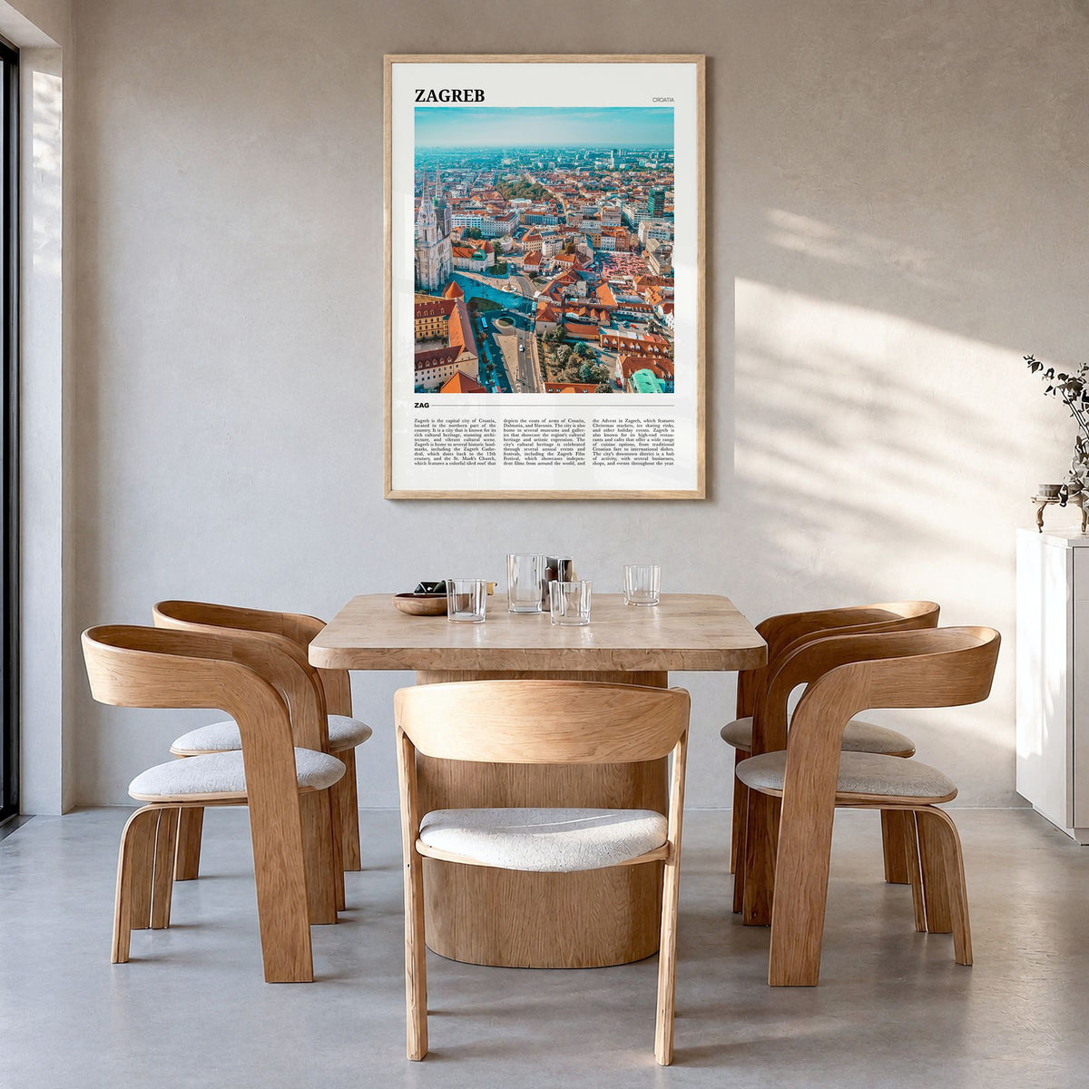 Zagreb Travel Poster in a natural wood frame, hanging in a dining room