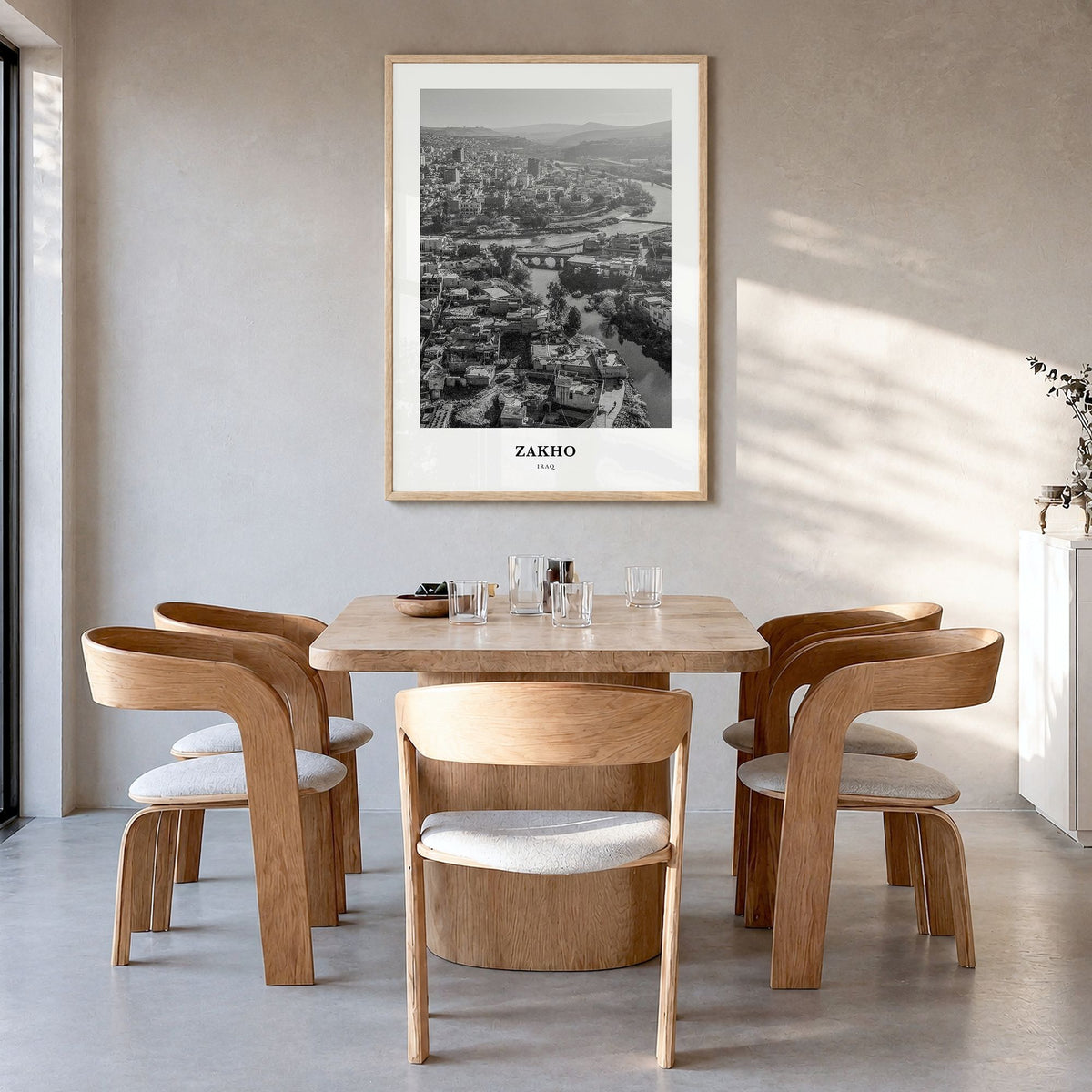 Zakho Classic Poster in a natural wood frame, hanging in a dining room