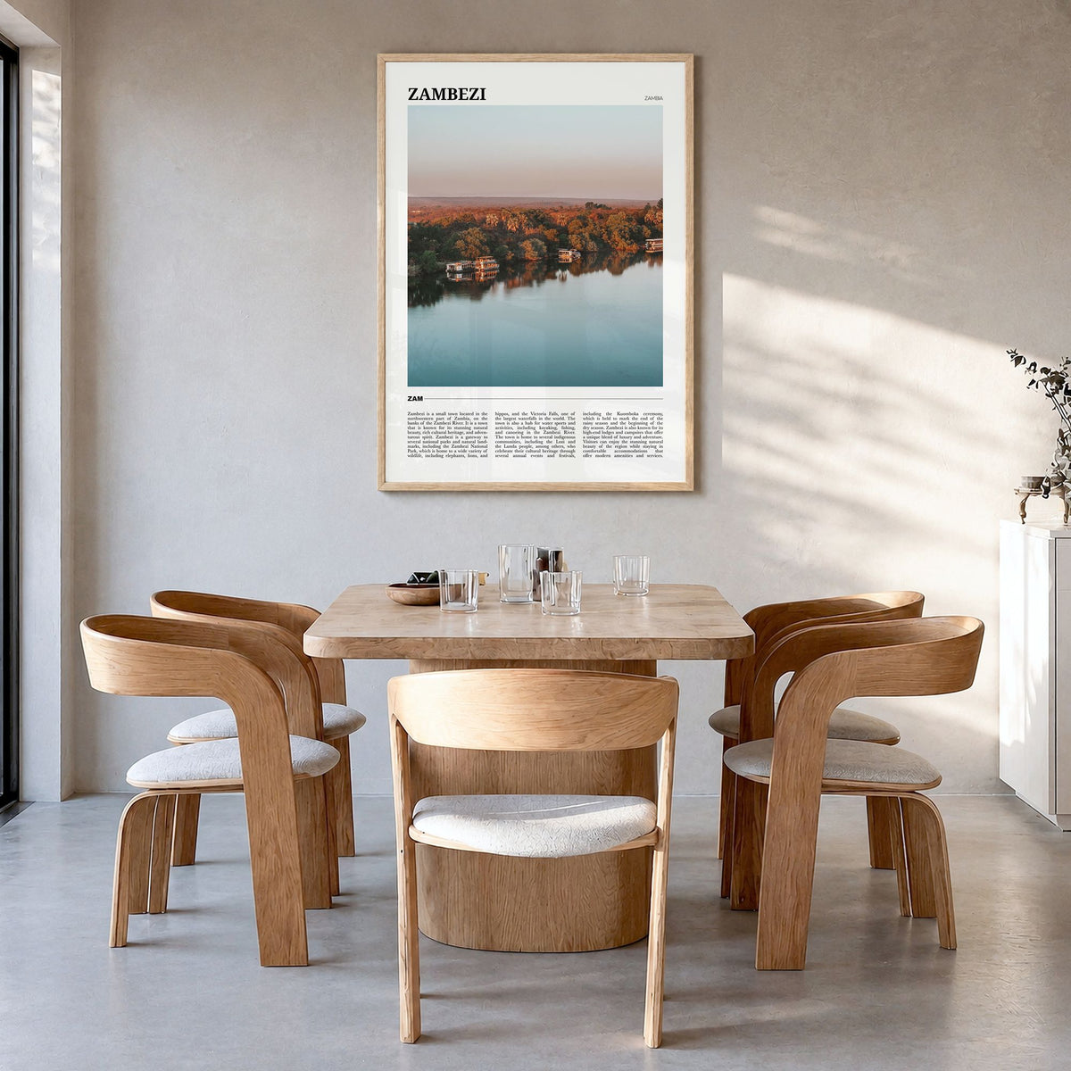 Zambezi Travel Poster in a natural wood frame, hanging in a dining room